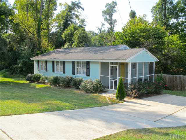 1217 North King Charles Road Raleigh, NC 27610 - Photo 3 of 17 a front view of a house with garden