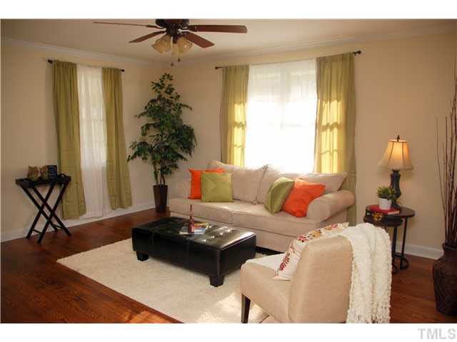 1217 North King Charles Road Raleigh, NC 27610 - Photo 4 of 17 a living room with furniture and a window