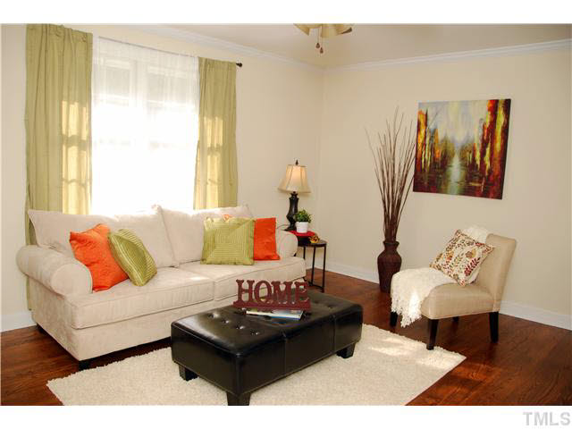 1217 North King Charles Road Raleigh, NC 27610 - Photo 5 of 17 a living room with furniture and a window