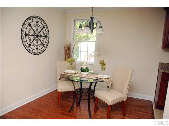 1217 North King Charles Road Raleigh, NC 27610 - Photo 6 of 17 a view of a dining room with furniture and window
