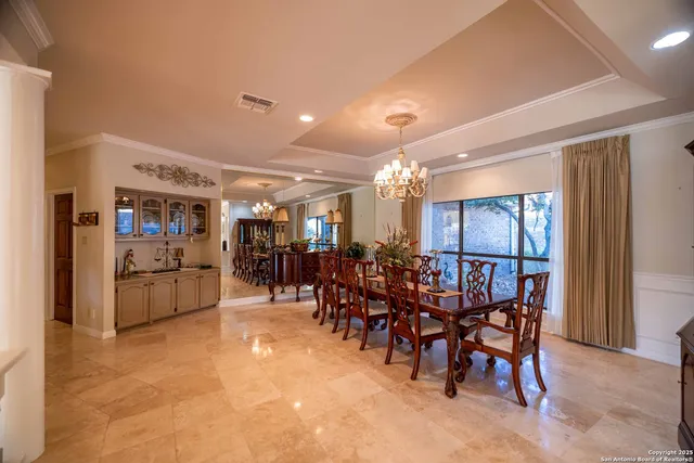 a view of a big room with furniture and chandelier
