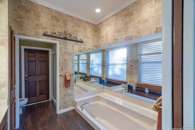 a view of a room with gym equipment and floor to ceiling window