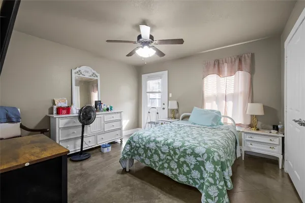 a bedroom with a bed and furniture