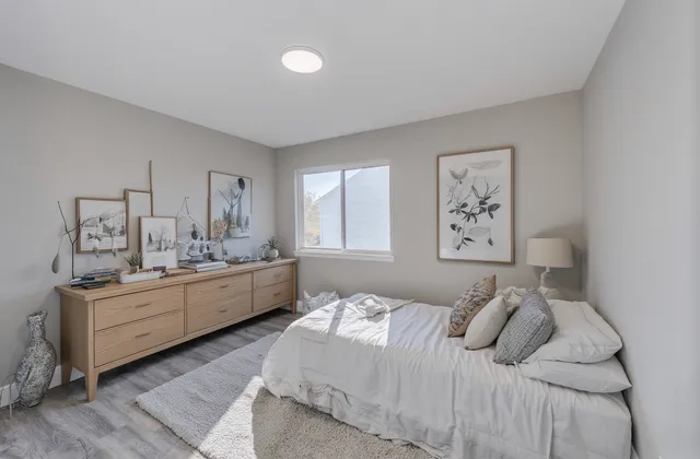 a room with a bed and window