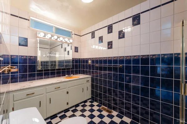 a bathroom with a shower and a sink