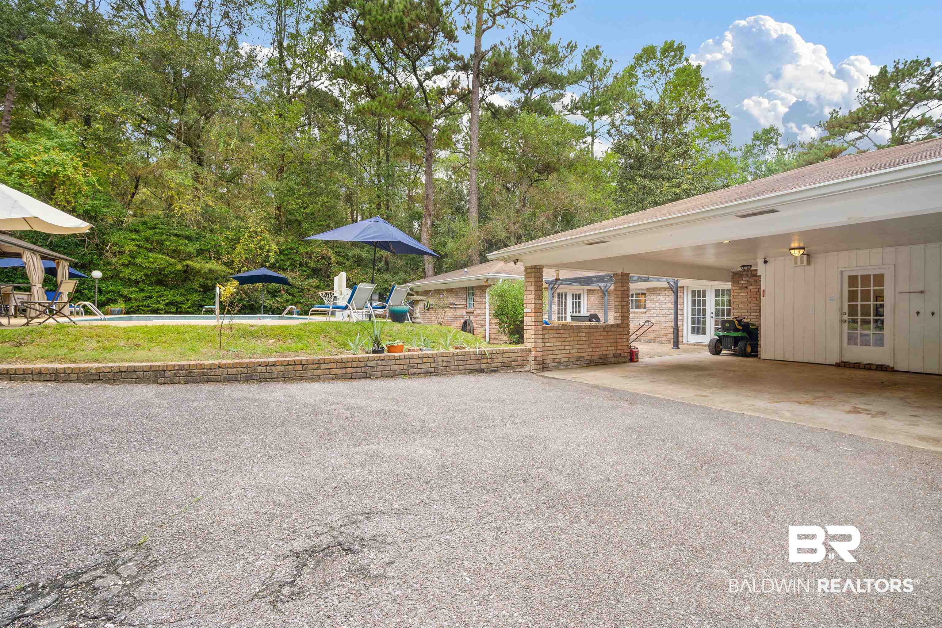 7807 Yorkhaven Road Mobile, AL 36695 - Photo 33 of 34 Exterior space featuring driveway and a carport