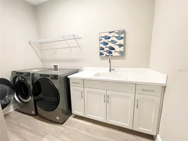a utility room with dryer and washer