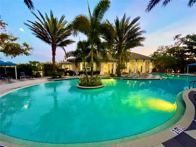 a view of a swimming pool with a table and chairs