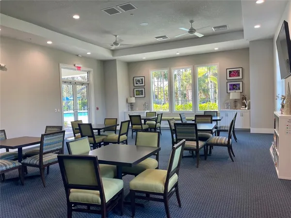 a view of a dining room with furniture window and outside view