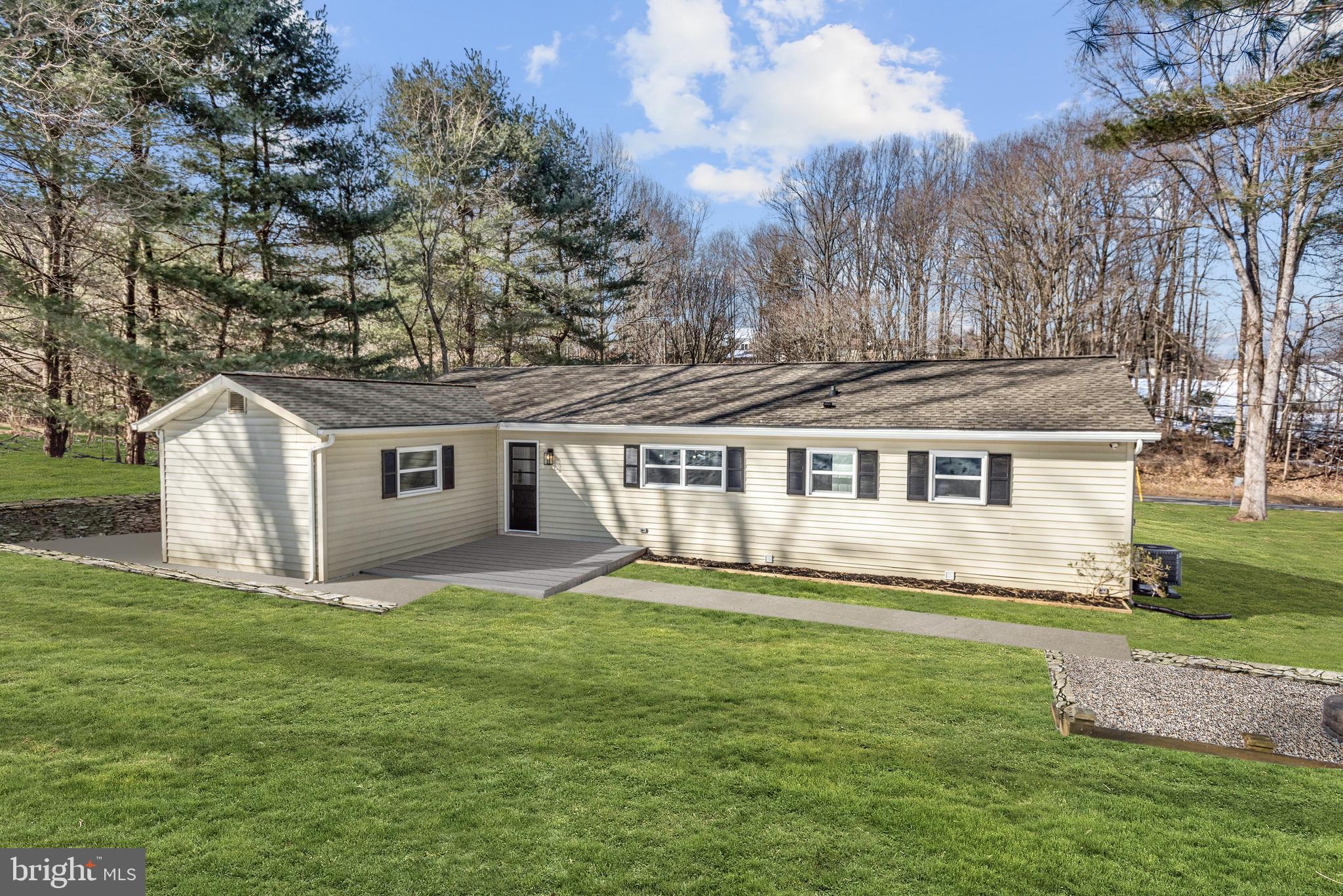 1903 Carrs Mill Road Fallston, MD 21047 - Photo 28 of 31 a house that is sitting in the grass with large trees