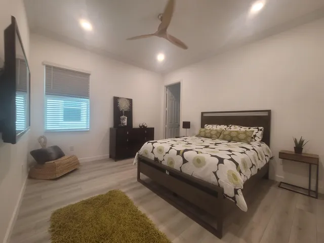 a bedroom with a bed and window