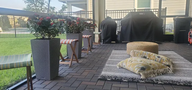 a front view of a house with outdoor seating