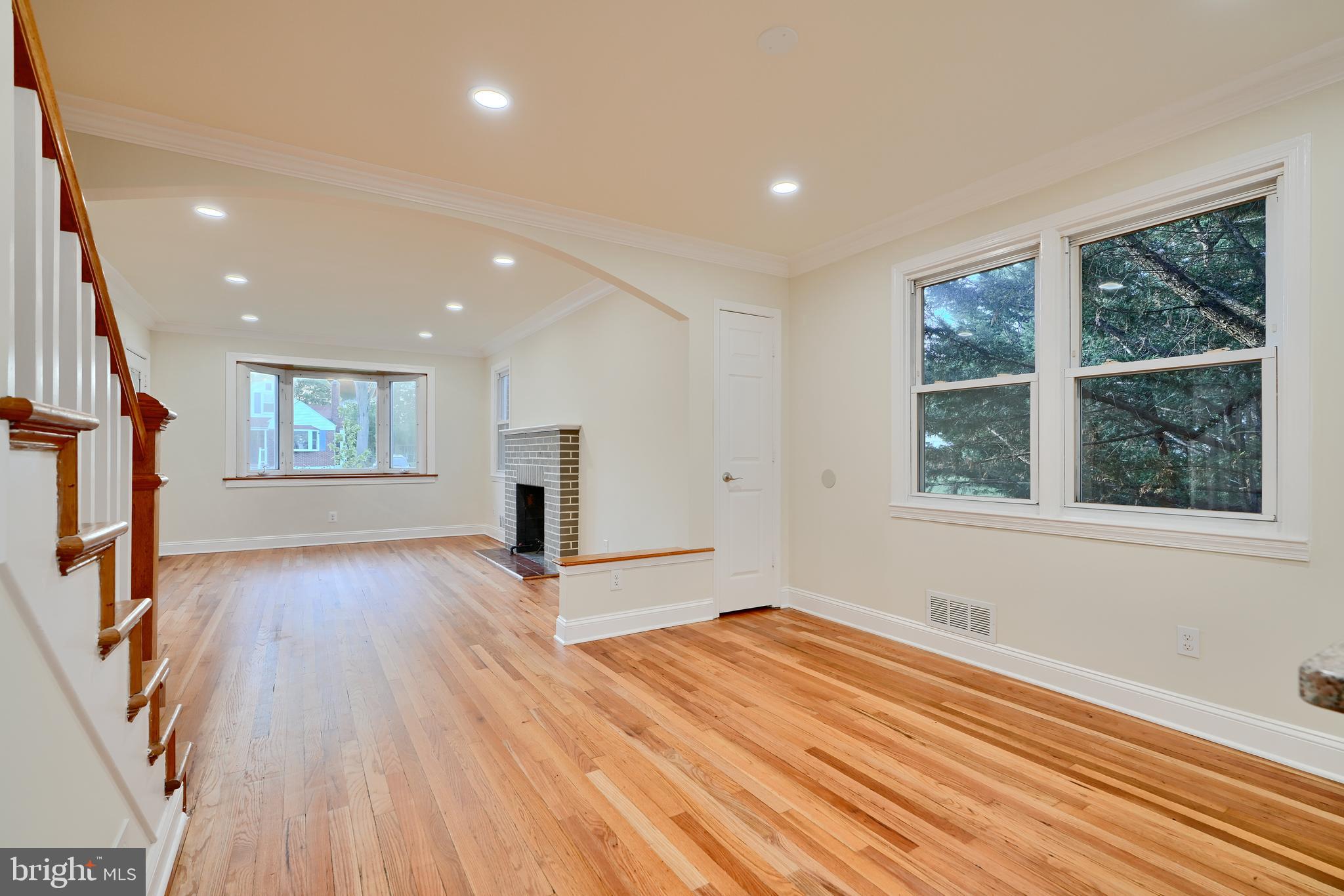 6409 Eastern Parkway Baltimore, MD 21214 - Photo 55 of 56 a view of empty room with wooden floor and fan
