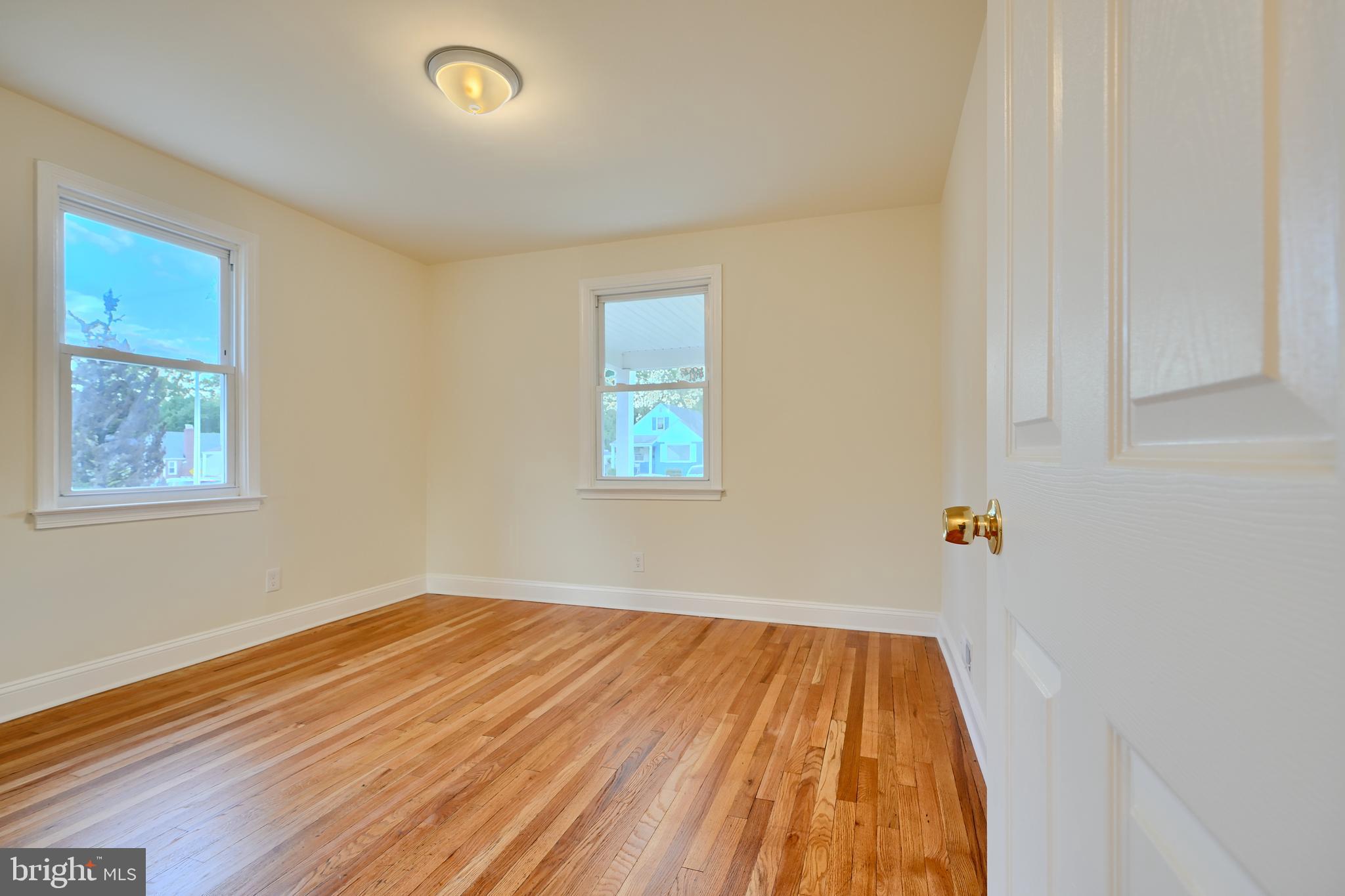 6409 Eastern Parkway Baltimore, MD 21214 - Photo 16 of 56 a view of a room with wooden floor and window