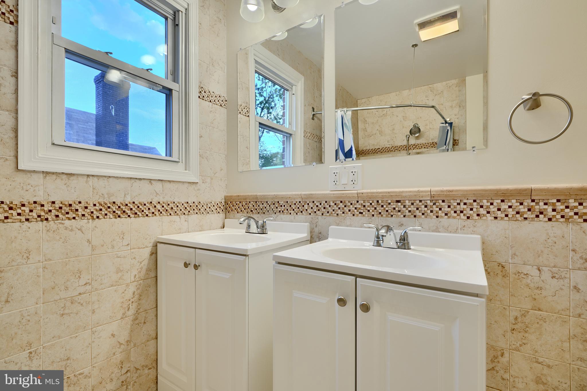 6409 Eastern Parkway Baltimore, MD 21214 - Photo 18 of 56 a bathroom with a sink and a mirror