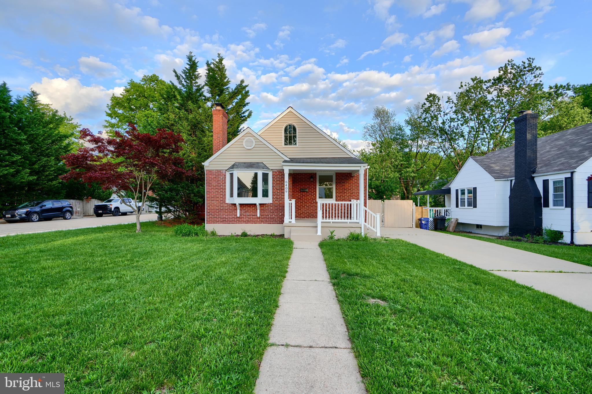 6409 Eastern Parkway Baltimore, MD 21214 - Photo 2 of 56 a front view of a house with yard