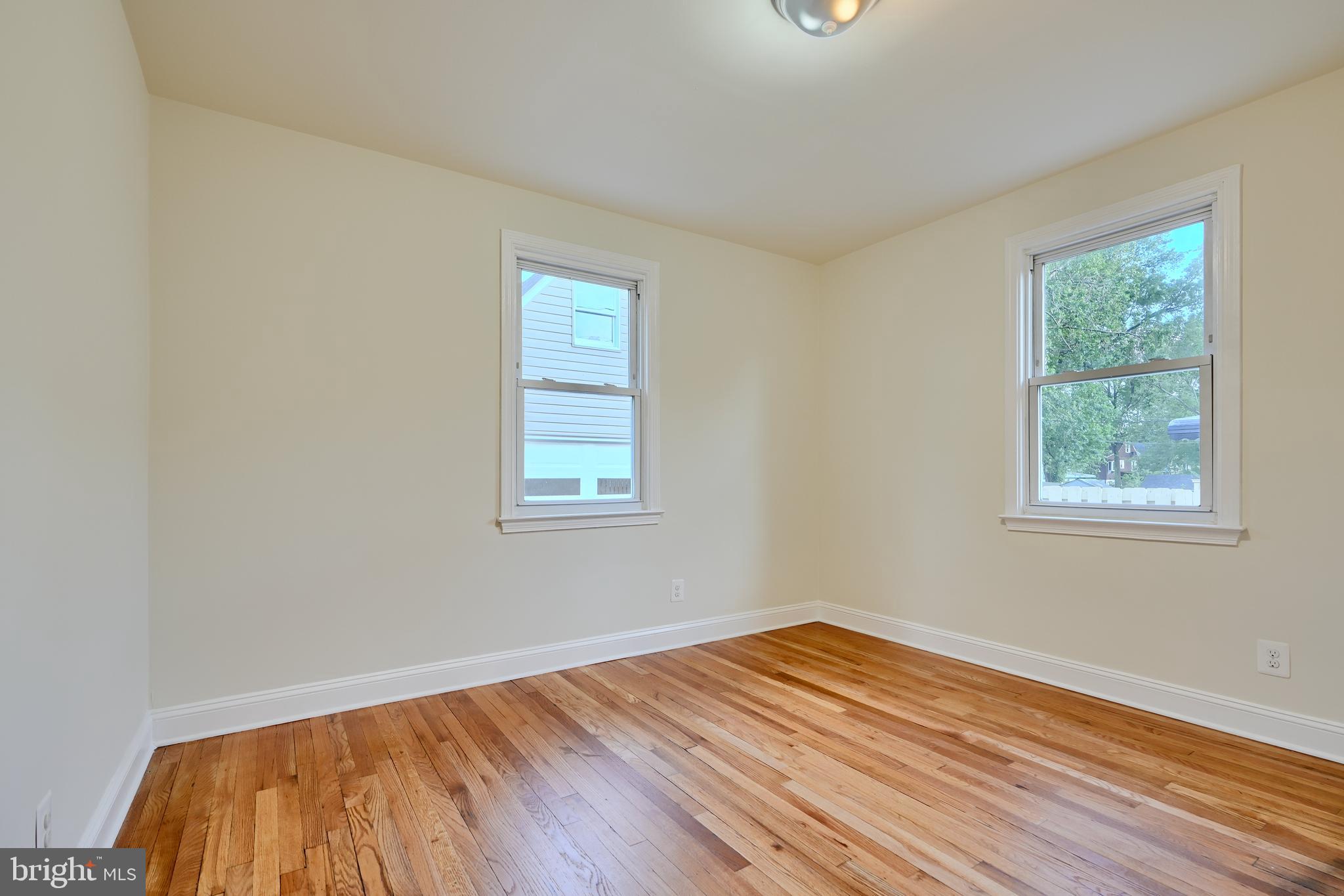 6409 Eastern Parkway Baltimore, MD 21214 - Photo 25 of 56 a view of empty room with wooden floor and fan