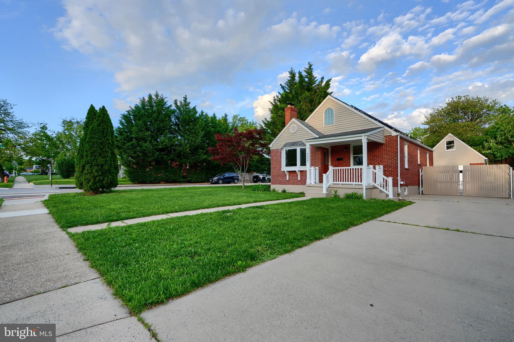 6409 Eastern Parkway Baltimore, MD 21214 - Photo 3 of 56 a front view of a house with a yard
