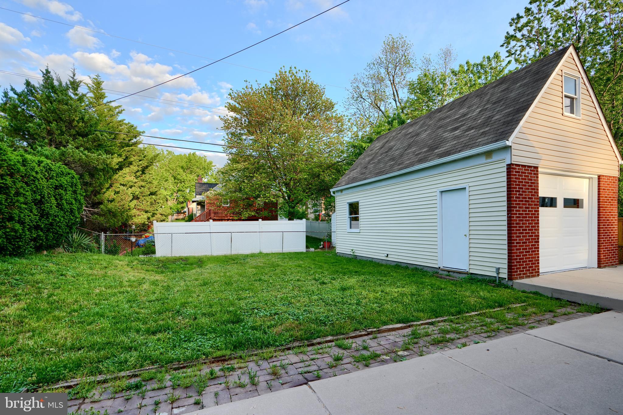 6409 Eastern Parkway Baltimore, MD 21214 - Photo 46 of 56 a view of a house with a yard