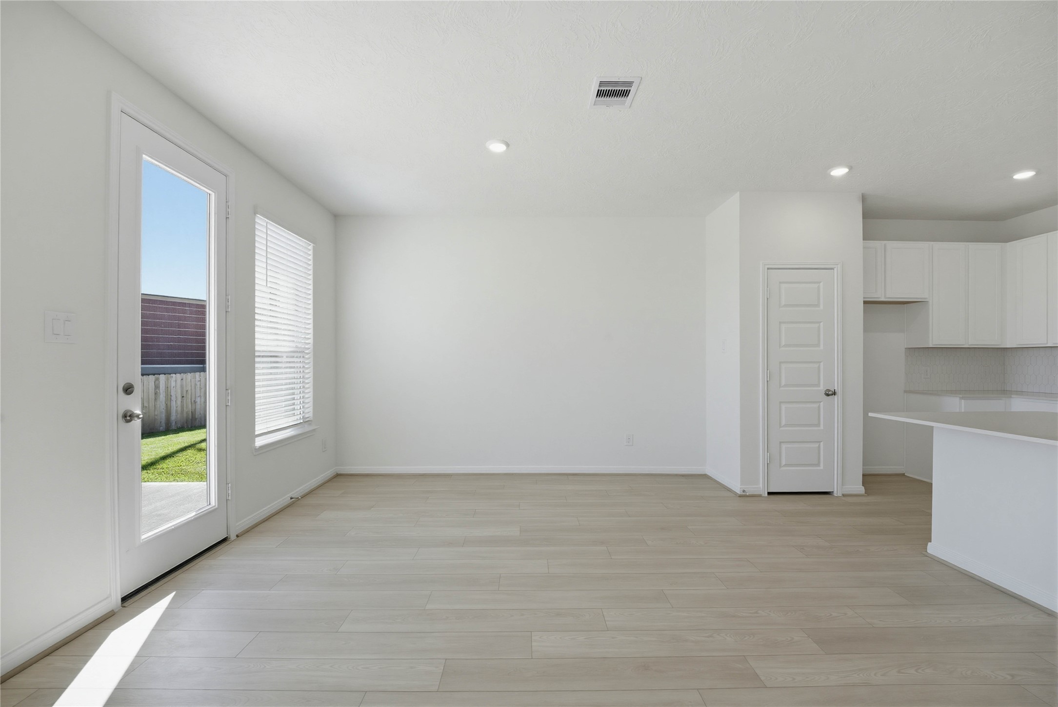 3530 Dryer Park Drive Spring, TX 77373 - Photo 11 of 31 Create lasting memories around the table with family and friends in this inviting dining room! It showcases high ceilings, large windows with privacy blinds, access door to the back patio and yard, vinyl plank flooring, and recessed lighting for a warm and welcoming atmosphere.