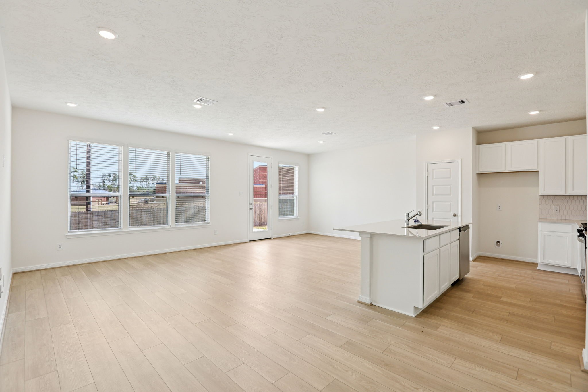 3530 Dryer Park Drive Spring, TX 77373 - Photo 21 of 48 Enjoy a commanding, uninterrupted view from the gourmet kitchen right into the Great Room, ensuring that the home chef is always part of the conversation and keeping everyone seamlessly connected.