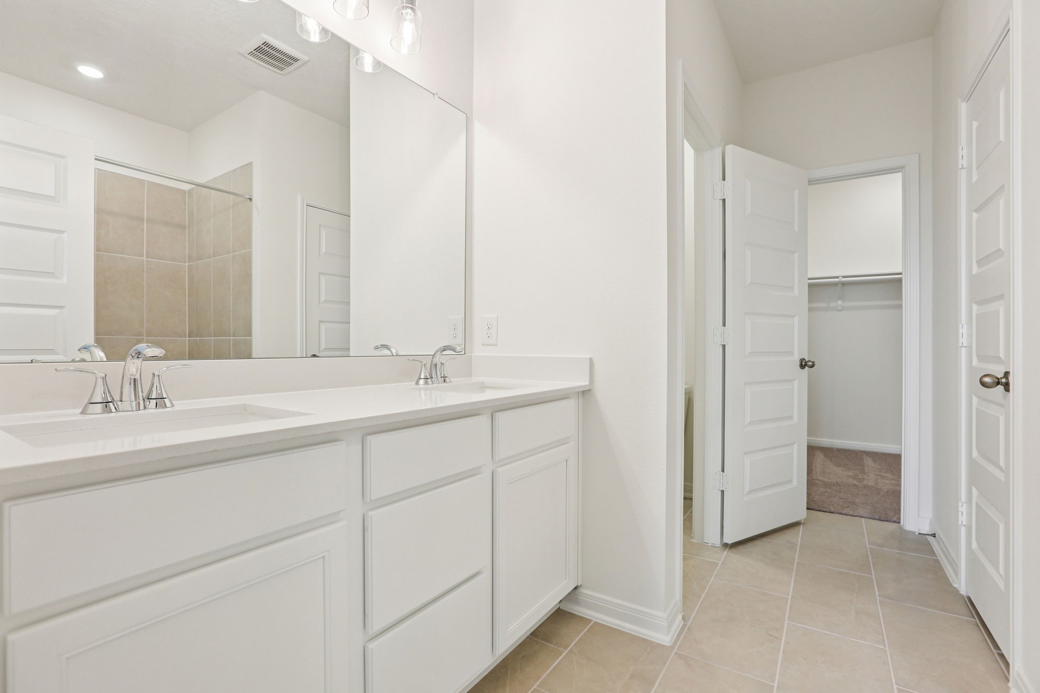 3530 Dryer Park Drive Spring, TX 77373 - Photo 26 of 48 This primary bathroom is definitely move-in ready! Featuring crisp white cabinets with light countertops, dual vanities, high ceilings, neutral paint, walk-in closet, sleek and modern finishes.
