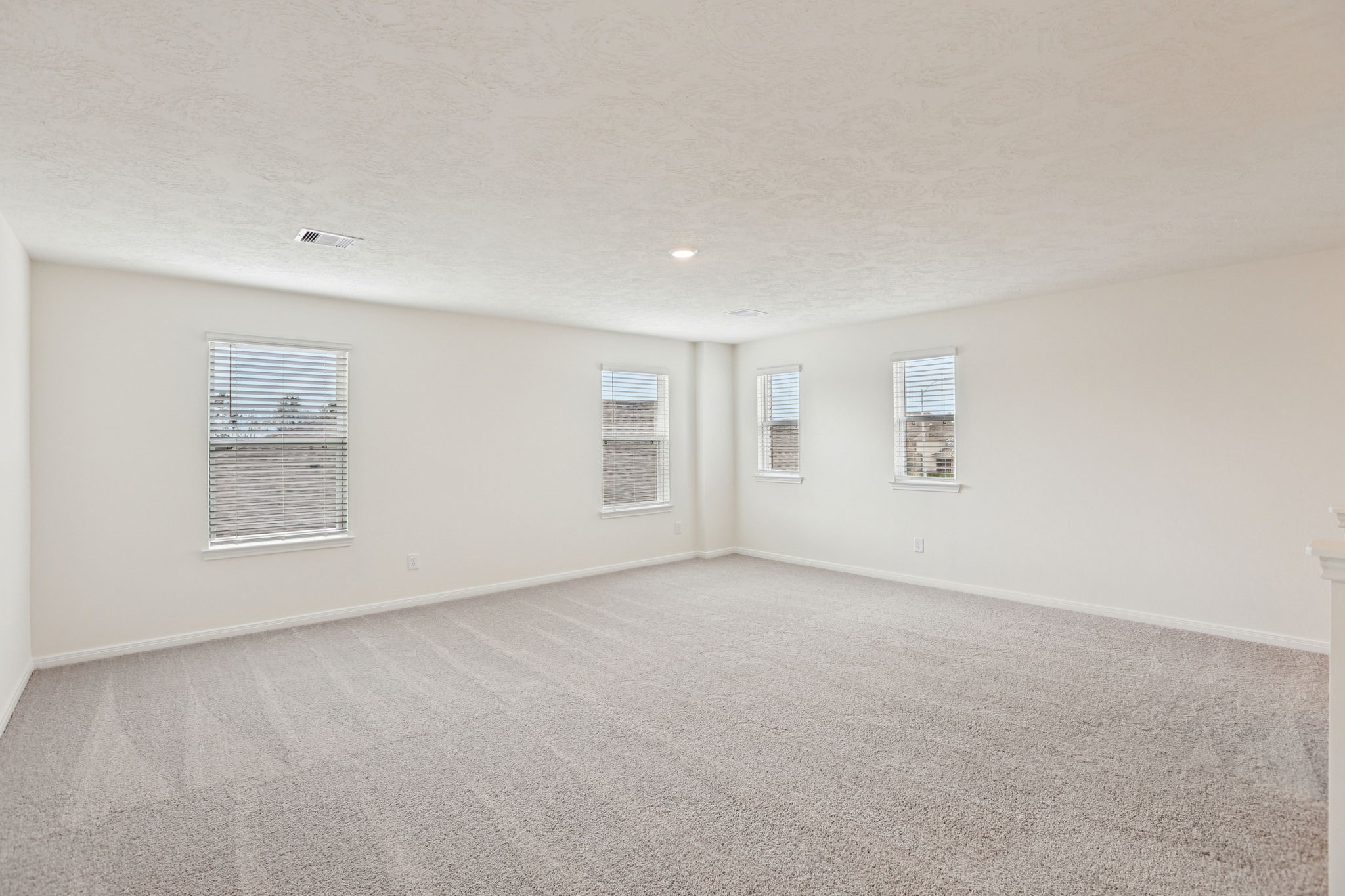 3530 Dryer Park Drive Spring, TX 77373 - Photo 29 of 48 Come upstairs and enjoy a day of leisure in this fabulous game room! This is the perfect hangout spot or adult game room, this space features plush carpet, high ceiling, lighting, custom paint and large windows with privacy blinds.