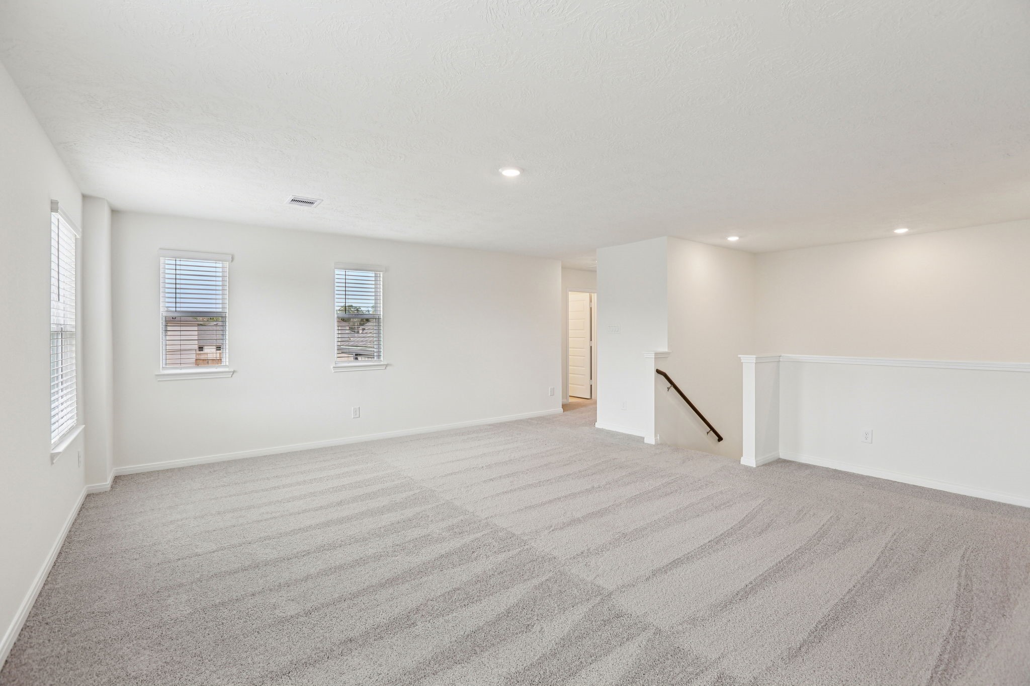 3530 Dryer Park Drive Spring, TX 77373 - Photo 31 of 48 Additional view from the game room looking towards staircase and secondary bedrooms and bathroom to the left.
