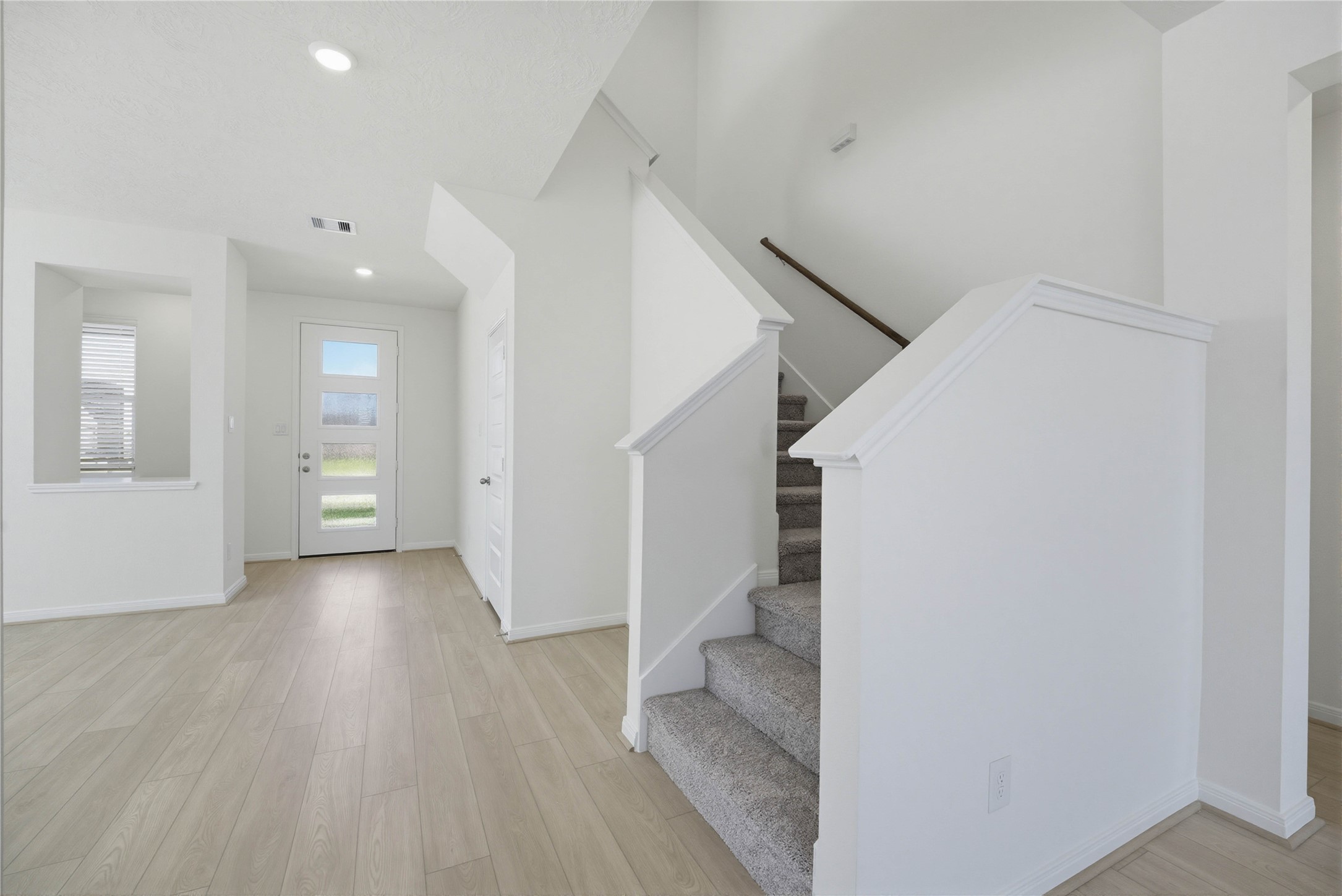 3530 Dryer Park Drive Spring, TX 77373 - Photo 5 of 31 The entry features a modern front door with elegant glass inserts. A display shelf has been added to the Flex Room for convenience, while the staircase provides access to the upstairs game room, secondary bedrooms, and bathroom.