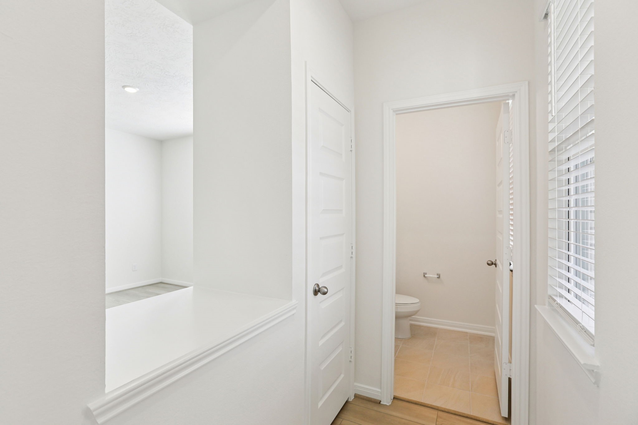 3530 Dryer Park Drive Spring, TX 77373 - Photo 8 of 48 In the hallway, there is a convenient window for added light and a open wall space from the flex room - so that sightlines to the front door are open and welcoming.