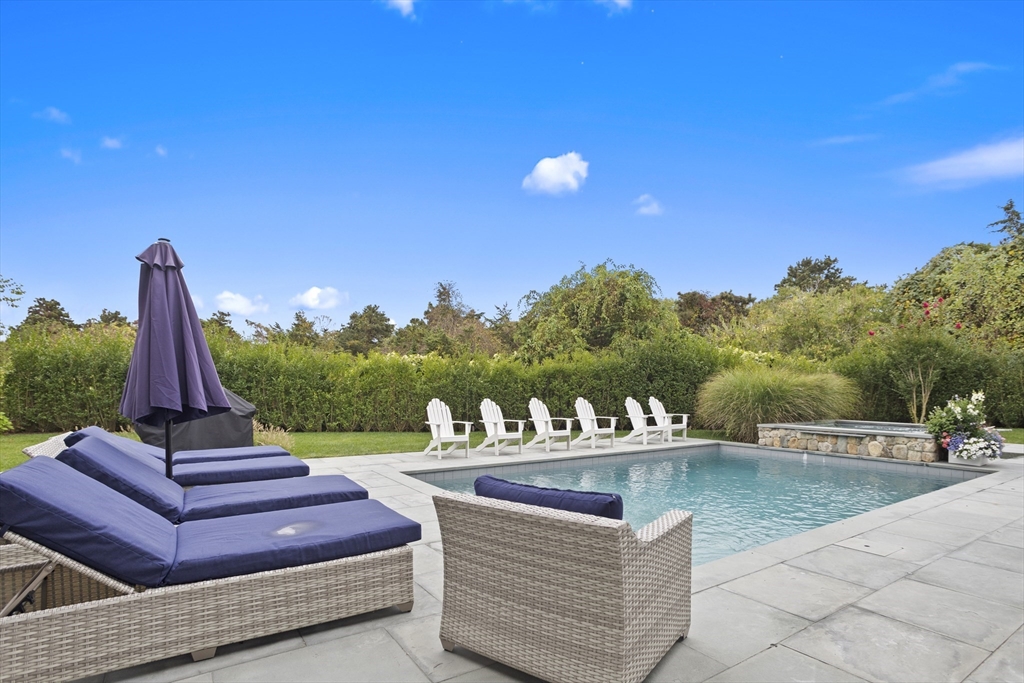 3 Old Mill Court Nantucket, MA 02554 - Photo 11 of 42 a view of a terrace with couches and wooden fence