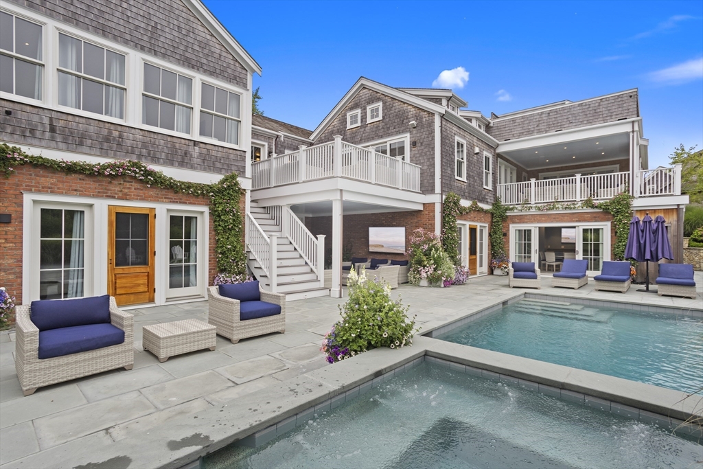 3 Old Mill Court Nantucket, MA 02554 - Photo 12 of 42 a view of a building with a large window and porch