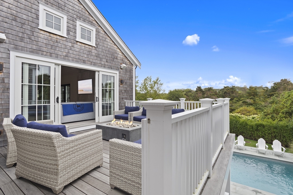 3 Old Mill Court Nantucket, MA 02554 - Photo 14 of 42 a view of a roof deck with couches and sky view