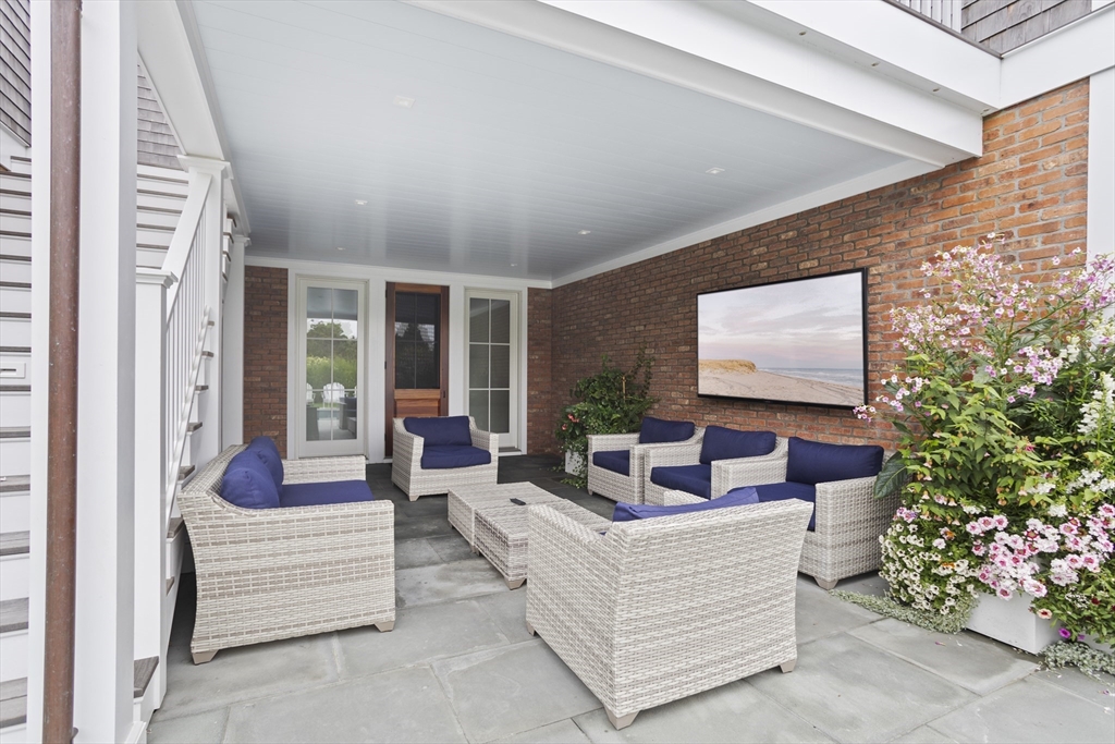 3 Old Mill Court Nantucket, MA 02554 - Photo 15 of 42 a living room with furniture and a potted plant