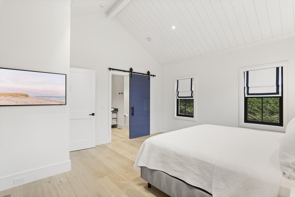 3 Old Mill Court Nantucket, MA 02554 - Photo 21 of 42 a bedroom with a large bed and a window
