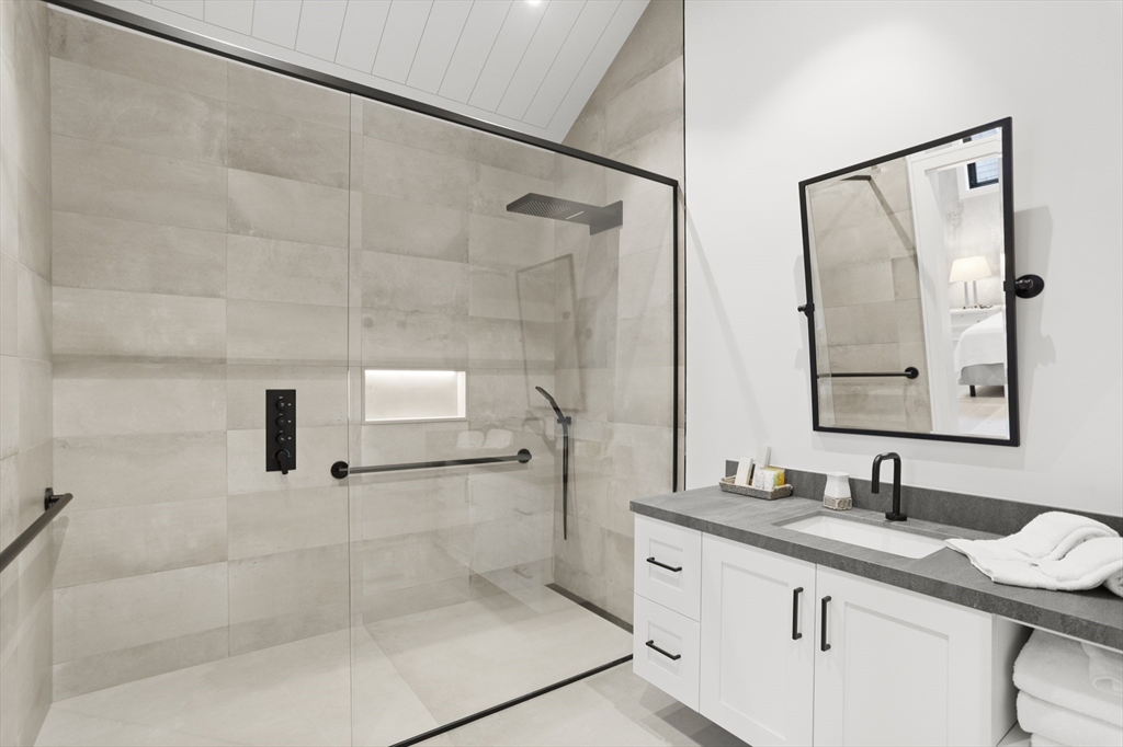 3 Old Mill Court Nantucket, MA 02554 - Photo 22 of 42 a bathroom with a granite countertop sink mirror and shower