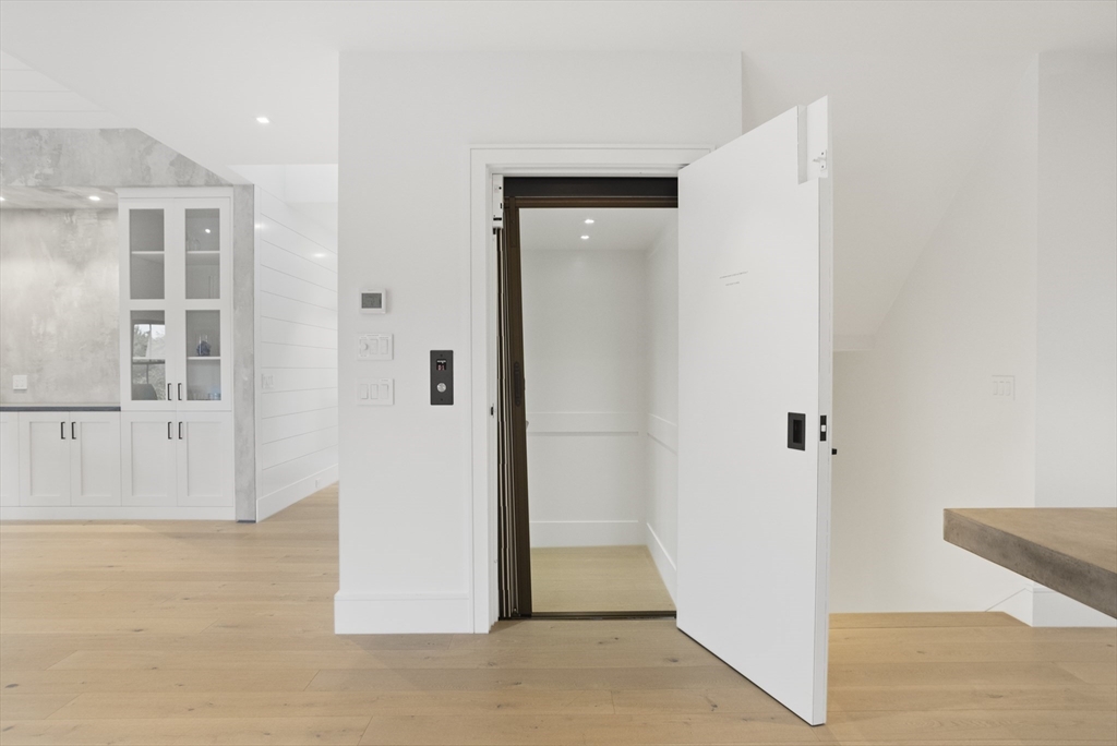 3 Old Mill Court Nantucket, MA 02554 - Photo 24 of 42 an entryway with wooden floor and windows
