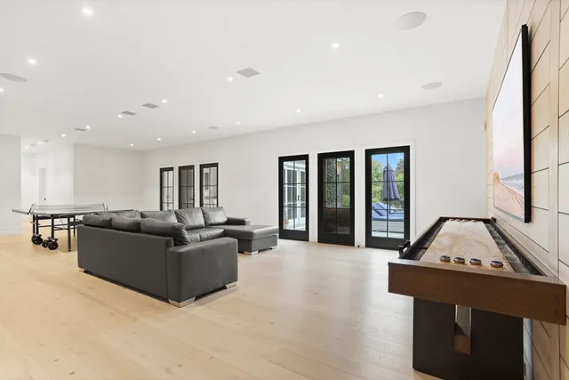 a living room with furniture window and wooden floor