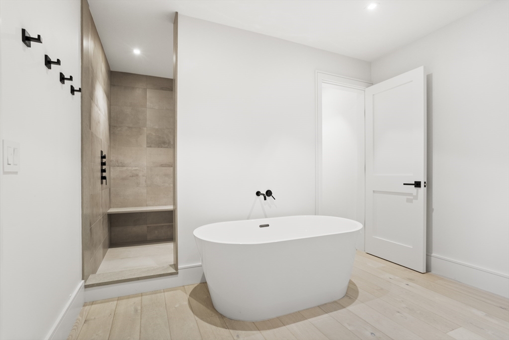 3 Old Mill Court Nantucket, MA 02554 - Photo 36 of 42 a bathroom with a bathtub and shower