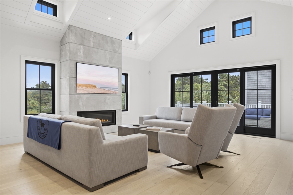 3 Old Mill Court Nantucket, MA 02554 - Photo 7 of 42 a living room with furniture and a floor to ceiling window