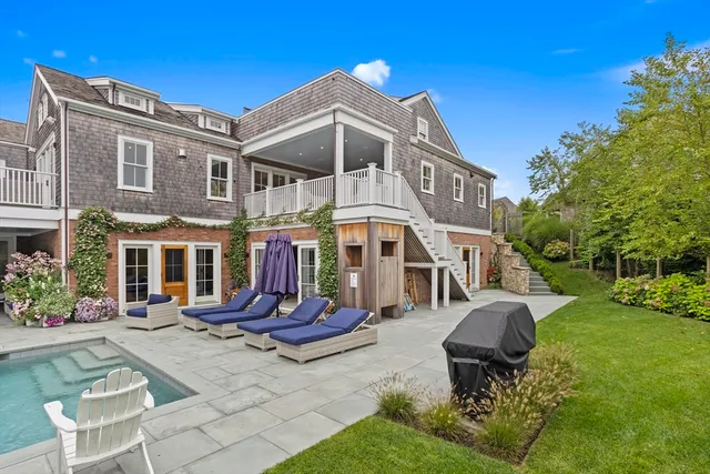 a view of a building with garden and sitting area