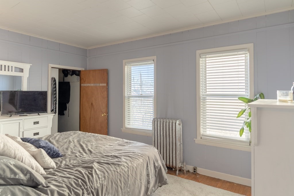 195 Barnaby Street Fall River, MA 02720 - Photo 11 of 25 a bedroom with a bed and a flat screen tv