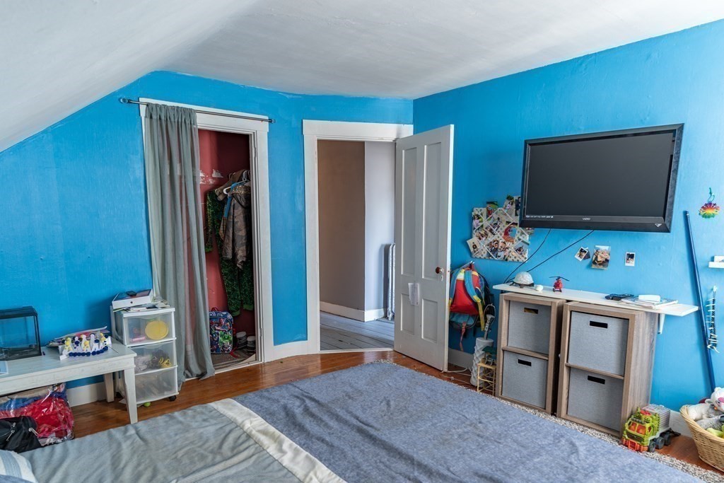 195 Barnaby Street Fall River, MA 02720 - Photo 18 of 25 a bedroom with furniture and a flat screen tv
