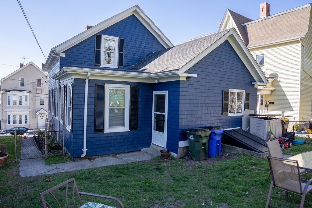 195 Barnaby Street Fall River, MA 02720 - Photo 23 of 25 a view of a house with a yard plants and a patio
