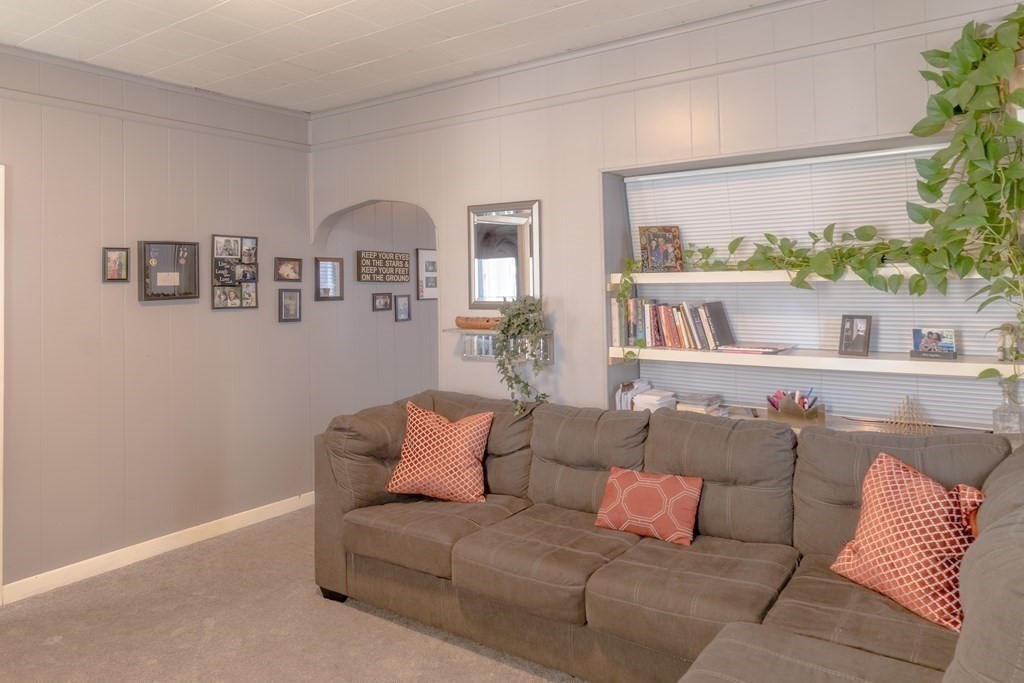 195 Barnaby Street Fall River, MA 02720 - Photo 8 of 25 a living room with furniture and a large window