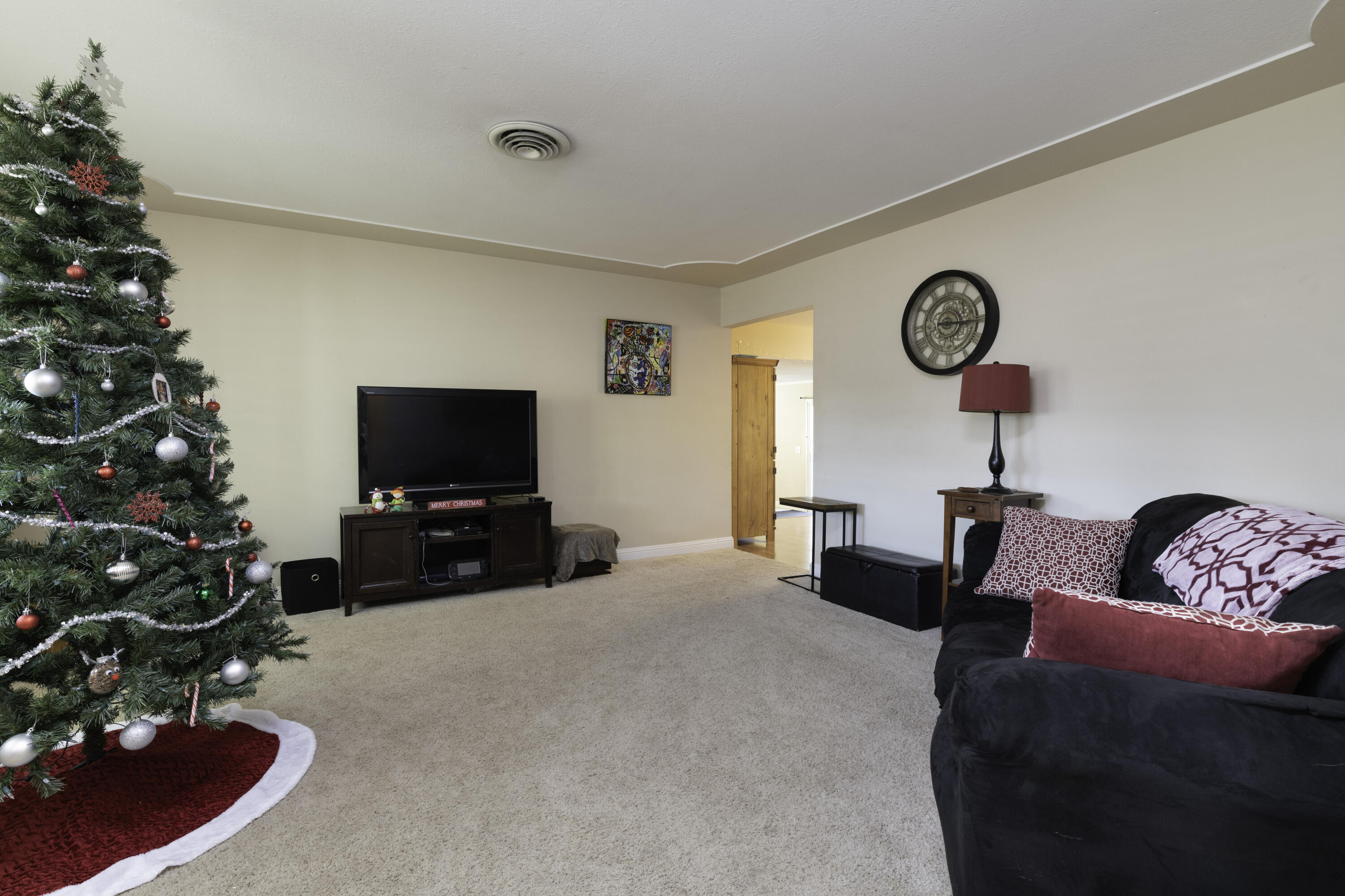 2816 Squire Avenue Redding, CA 96002 - Photo 2 of 13 a living room with furniture and a flat screen tv