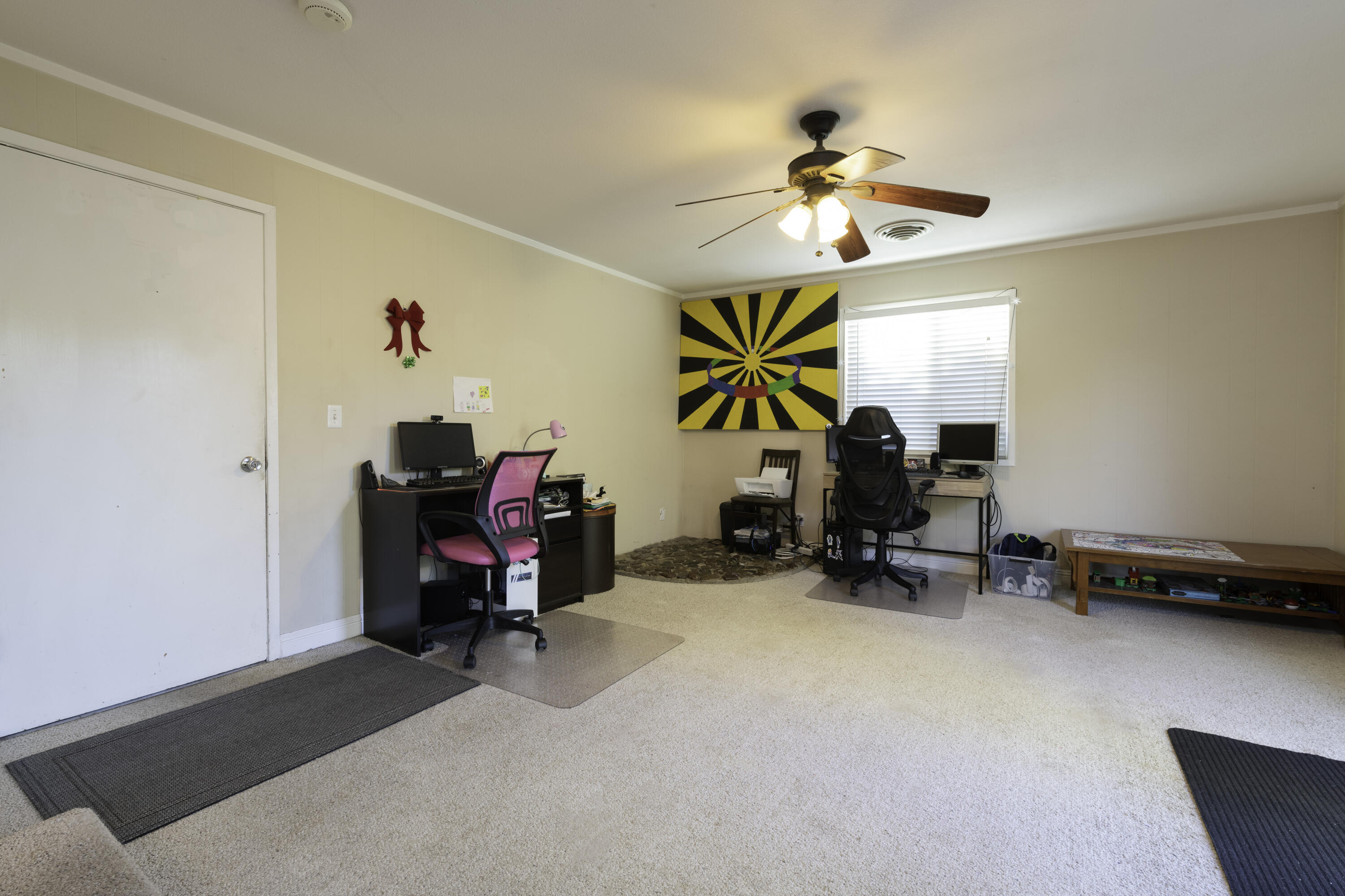 2816 Squire Avenue Redding, CA 96002 - Photo 5 of 13 a view of a room with furniture and a chandelier fan