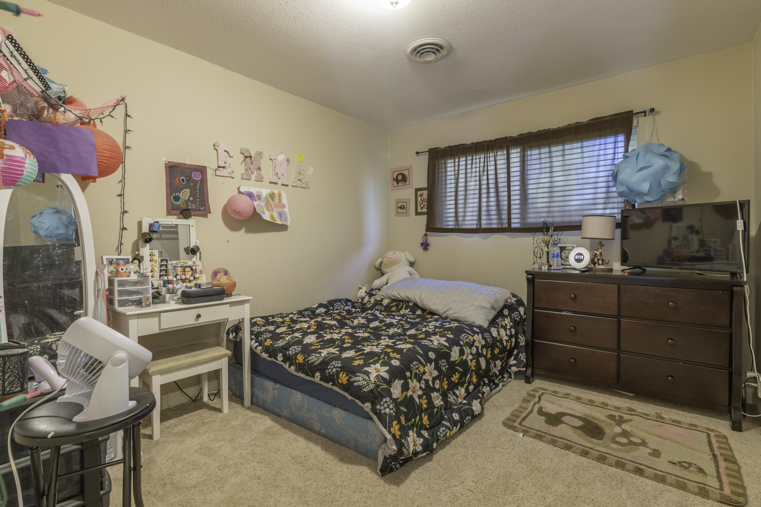 2816 Squire Avenue Redding, CA 96002 - Photo 8 of 13 a bedroom with a bed and furniture with window