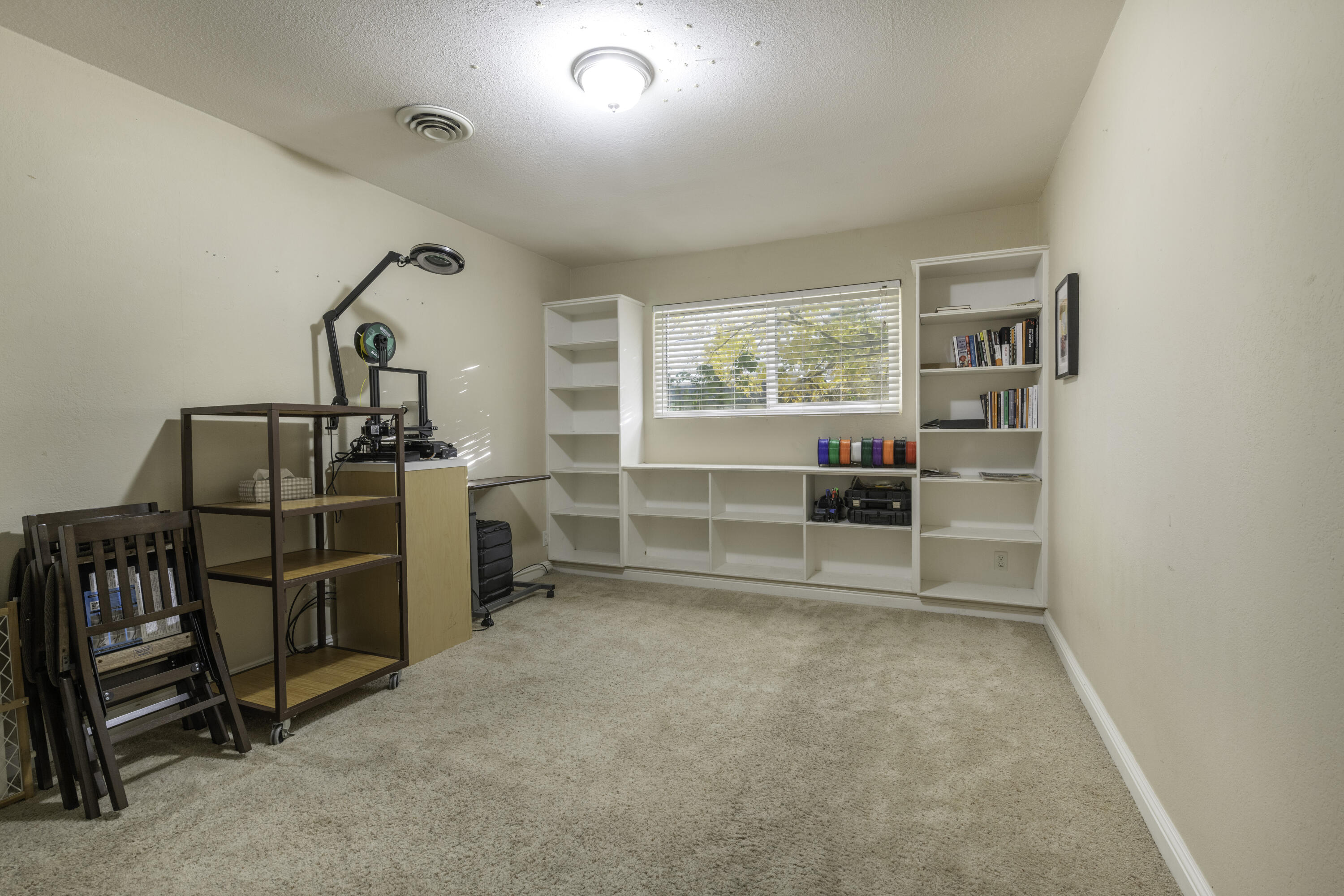 2816 Squire Avenue Redding, CA 96002 - Photo 9 of 13 a room with furniture and a window