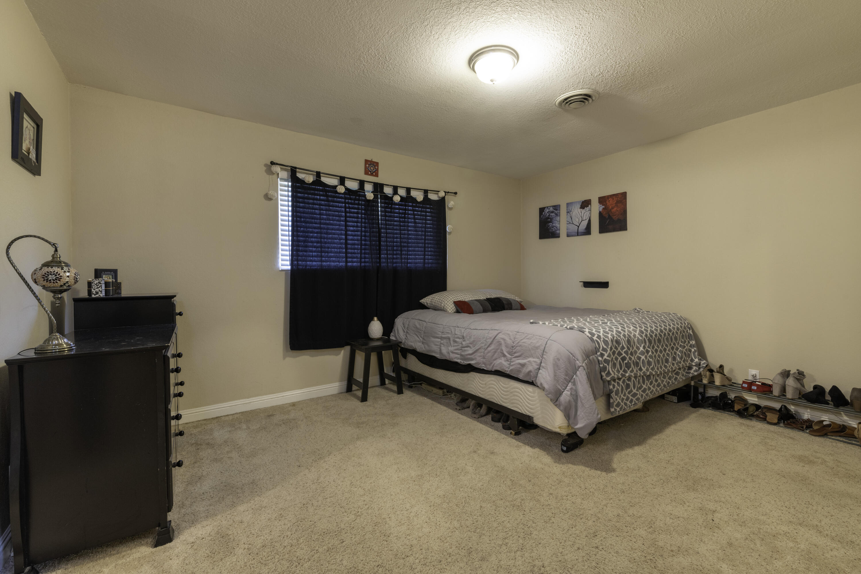 2816 Squire Avenue Redding, CA 96002 - Photo 10 of 13 a bedroom with a bed and a desk